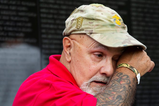 Vietnam Marine Corps veteran Eugene "Aggie" Agriesti wipes a tear from his eye after making a rubbing of the names of friends killed during the Vietnam War at the Vietnam War Memorial Wall in Washington D.C.  during Honor Flight Columbus Mission #104 Sept. 9. "I was there when they were killed," Agriesti said. "I see their faces almost every day. This is my first time coming to The Wall, I put it off for a long time. I feel better about coming here. It gives me some closure." Honor Flights began in 2005 to bring surviving World War II veterans to Washington D.C. to visit the World War II memorial after it was completed in 2004. 