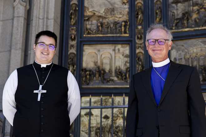 Bishops&#x20;Megan&#x20;Rohrer,&#x20;left,&#x20;and&#x20;Marc&#x20;Andrus&#x20;pose&#x20;for&#x20;the&#x20;media&#x20;before&#x20;Bishop&#x20;Rohrer&amp;apos&#x3B;s&#x20;installation&#x20;ceremony&#x20;at&#x20;Grace&#x20;Cathedral&#x20;in&#x20;San&#x20;Francisco,&#x20;Saturday,&#x20;Sept.&#x20;11,&#x20;2021.&#x20;Rohrer&#x20;is&#x20;the&#x20;first&#x20;openly&#x20;transgender&#x20;person&#x20;elected&#x20;as&#x20;bishop&#x20;in&#x20;the&#x20;Evangelical&#x20;Lutheran&#x20;Church&#x20;of&#x20;America.&#x20;&#x28;AP&#x20;Photo&#x2F;John&#x20;Hefti&#x29;