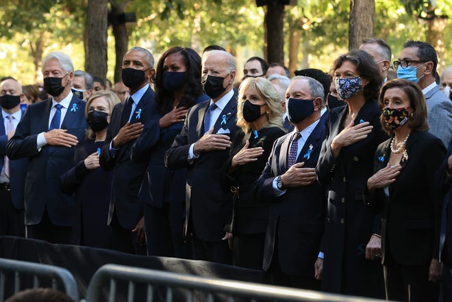 Former President Bill Clinton, former First Lady Hillary Clinton, former President Barack Obama, former First Lady Michelle Obama, President Joe Biden, First Lady Jill Biden, former New York City Mayor Michael Bloomberg, Bloomberg's partner Diana Taylor and Speaker of the House Nancy Pelosi (D-CA) stand for the national anthem during the annual 9/11 Commemoration Ceremony at the National 9/11 Memorial and Museum on September 11, 2021 in New York City.