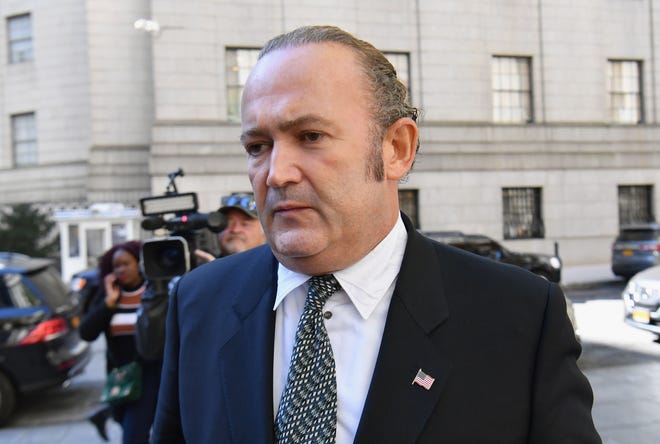 Photo shows Igor Fruman leaving Manhattan federal court in New York City after a criminal arraignment hearing on October 23, 2019. (Photo by Angela Weiss / AFP) (Photo by ANGELA WEISS/AFP via Getty Images) ORIG FILE ID: AFP_1LO3Z3