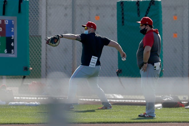 Cincinnati Reds director of pitching Kyle Boddy (right) oversees a session during a midday spring training workout at the Cincinnati Reds Player Development Complex in Goodyear, Ariz., on Saturday, Feb. 27, 2021.