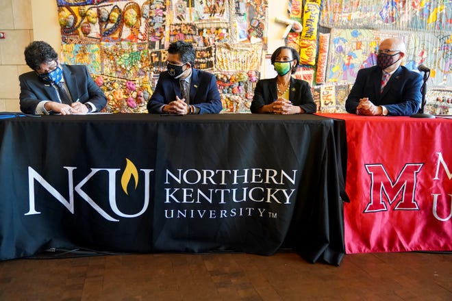 Fernando Figueroa (left), president of Gateway Community and Technical College, Ashish Vaidya, president of Northern Kentucky University, Monica Posey, president of Cincinnati State and Gregory Crawford, president of Miami University, sign a memorandum of understanding to launch the "Moon Shot for Equity," a national initiative to close racial and ethnic equity gaps in higher education by 2030, Wednesday, Sept. 15, 2021, at the National Underground Freedom Center and Museum in Cincinnati.
