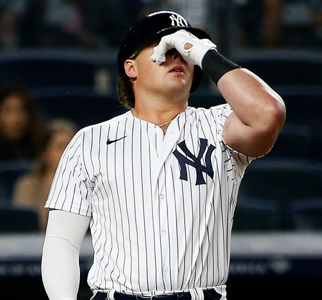 Luke Voit reacts after striking out.