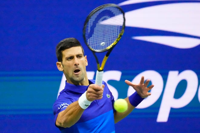 Top seed Novak Djokovic hits a forehand against No. 4 seed Alexander Zverev during Friday's U.S. Open men's semifinal.