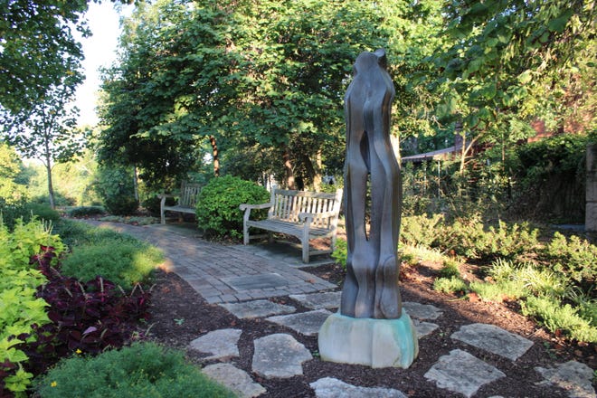 In Eden Park, the path through Cincinnati's garden built after the 9/11 attacks leads to "Remembrance," a bronze sculpture by Blue Ash artist Jarrett Hawkins.