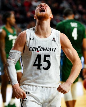 Cincinnati Bearcats guard Mason Madsen (45) reacts after scoring a drawing a foul in the second half of a men's NCAA basketball game against the Tulane Green Wave, Friday, Feb. 26, 2021, at Fifth Third Arena in Cincinnati. The Cincinnati Bearcats won, 91-71.