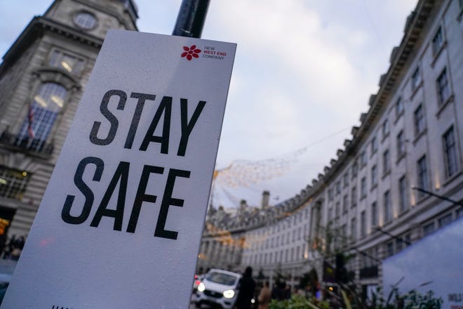 A sign reading 'Stay safe' is shown on Regent Street in London on Friday amid news of the latest COVID-19 variant of concern.