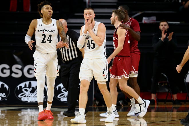 Cincinnati Bearcats guard Mason Madsen (45) reacts after being called for a foul in the second half of an NCAA men's college basketball game against the Temple Owls, Friday, Feb. 12, 2021, at Fifth Third Arena in Cincinnati. The Cincinnati Bearcats won, 71-69.
