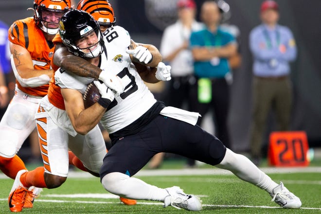 Cincinnati Bengals strong safety Vonn Bell (24) tackle Jacksonville Jaguars tight end Luke Farrell (89) in the first half of the NFL football game between the Cincinnati Bengals and the Jacksonville Jaguars on Thursday, Sept. 30, 2021, at Paul Brown Stadium in Cincinnati. 
