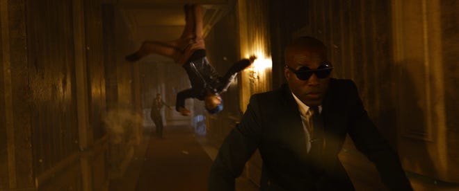 Bugs (Jessica Henwick) aids Morpheus (Yahya Abdul-Mateen II)
in "Matrix Resurrections."