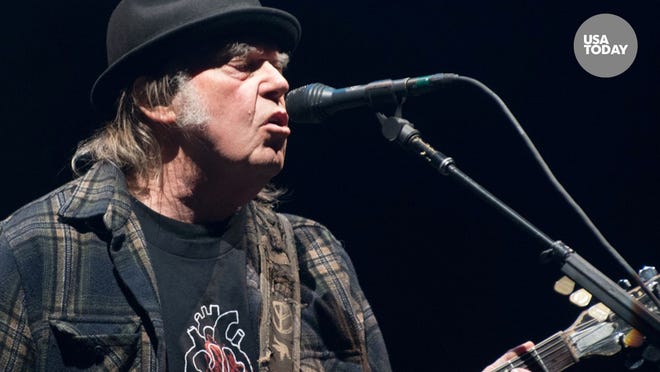 The legendary rocker accuses music platform Spotify of "spreading fake information about vaccines," and calls out popular talk show host Joe Rogan.